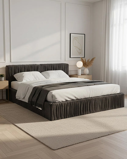 Modern bedroom with a bed, nightstands, and wall art.