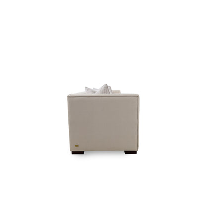 Beige armchair with a white pillow on a white background