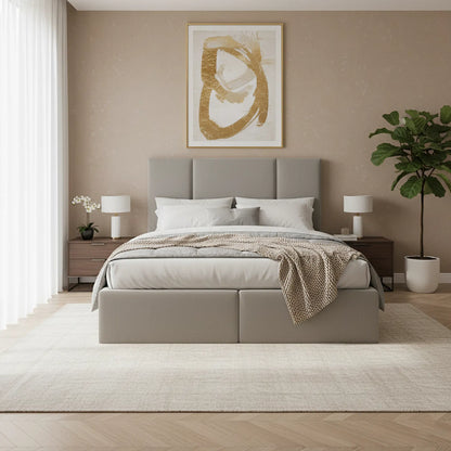 Neatly made bed in a bedroom with abstract art on the wall and side tables.