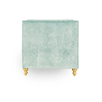 Green velvet side table with gold legs on a white background
