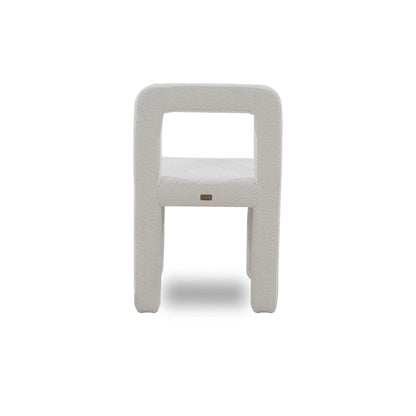 White chair with a small logo on a white background