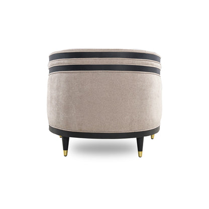 Round ottoman with beige fabric and black band on a white background