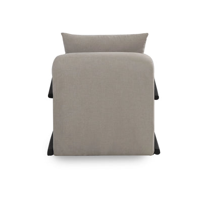 Gray upholstered chair with a pillow on a white background