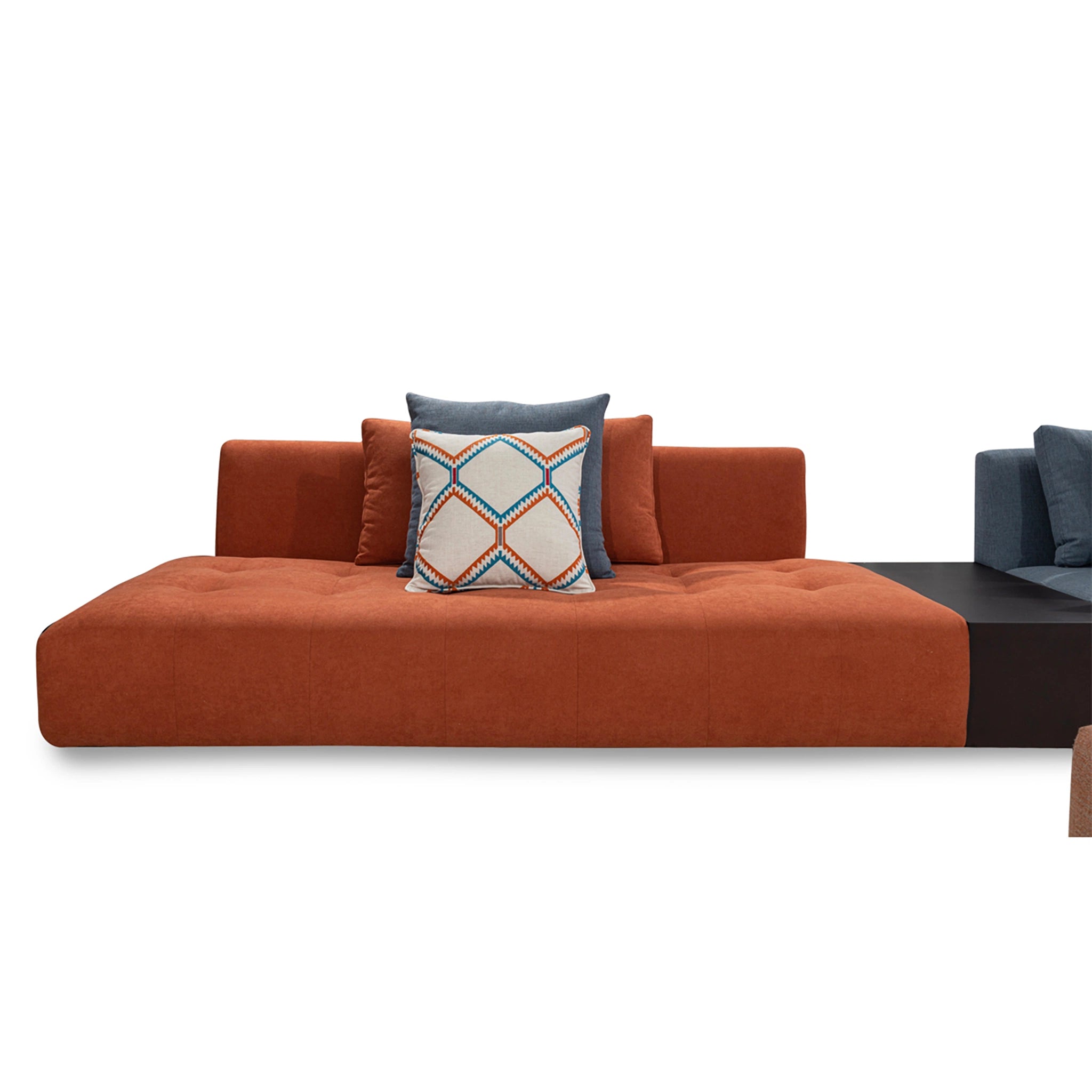 Orange sofa with a decorative pillow on a white background