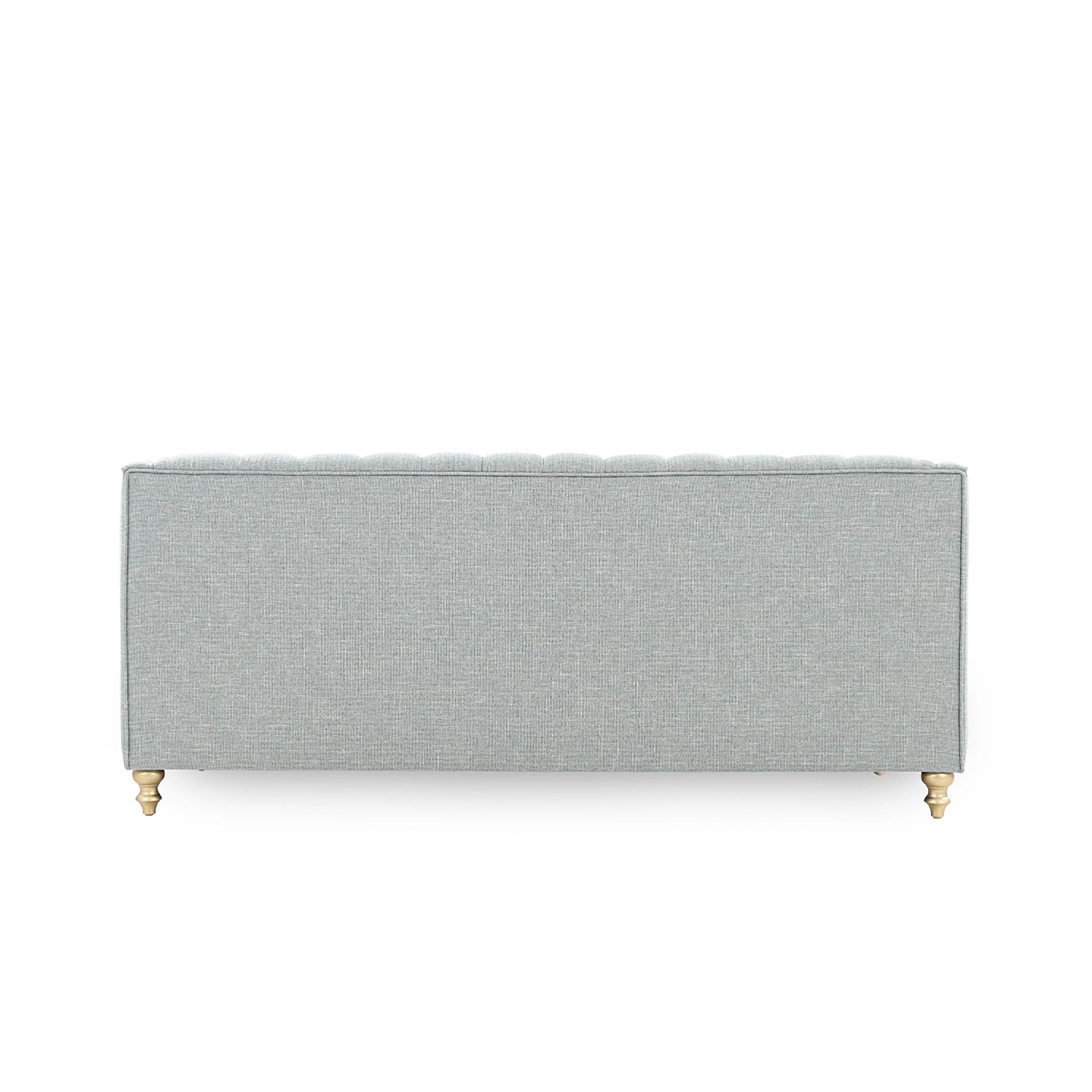 Gray upholstered headboard with gold legs on a white background