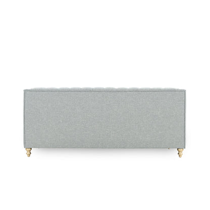 Gray upholstered headboard with gold legs on a white background