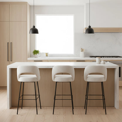 Modern kitchen with a white island and three bar stools.