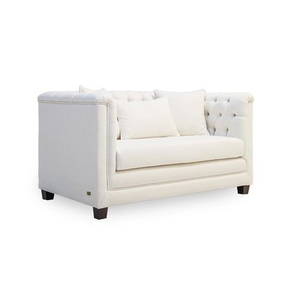 White tufted sofa on a white background
