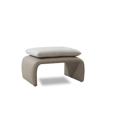 Beige footstool with a white cushion on a white background