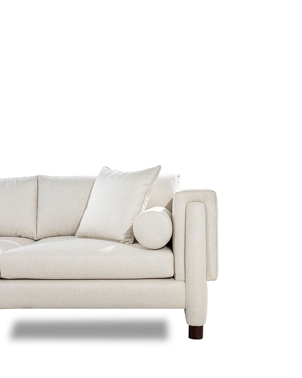 Beige sofa with cushions on a white background