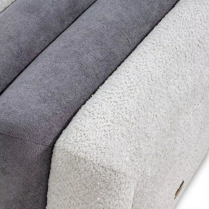 Close-up of textured fabric swatches in gray and white.