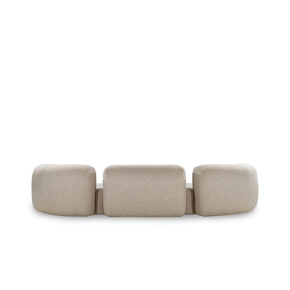 Beige modular sofa with three cushioned sections on a white background