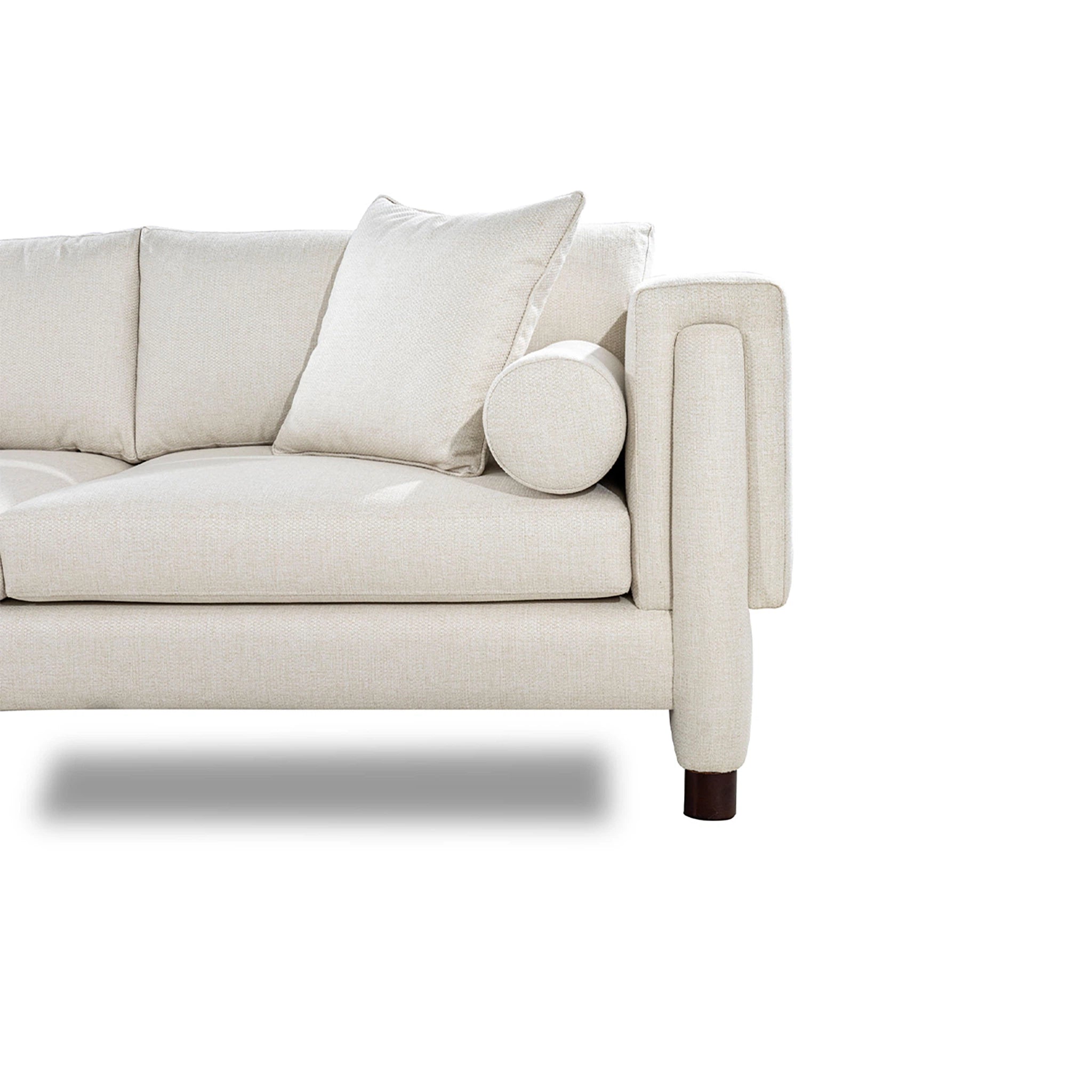 Beige sofa with cushions on a white background