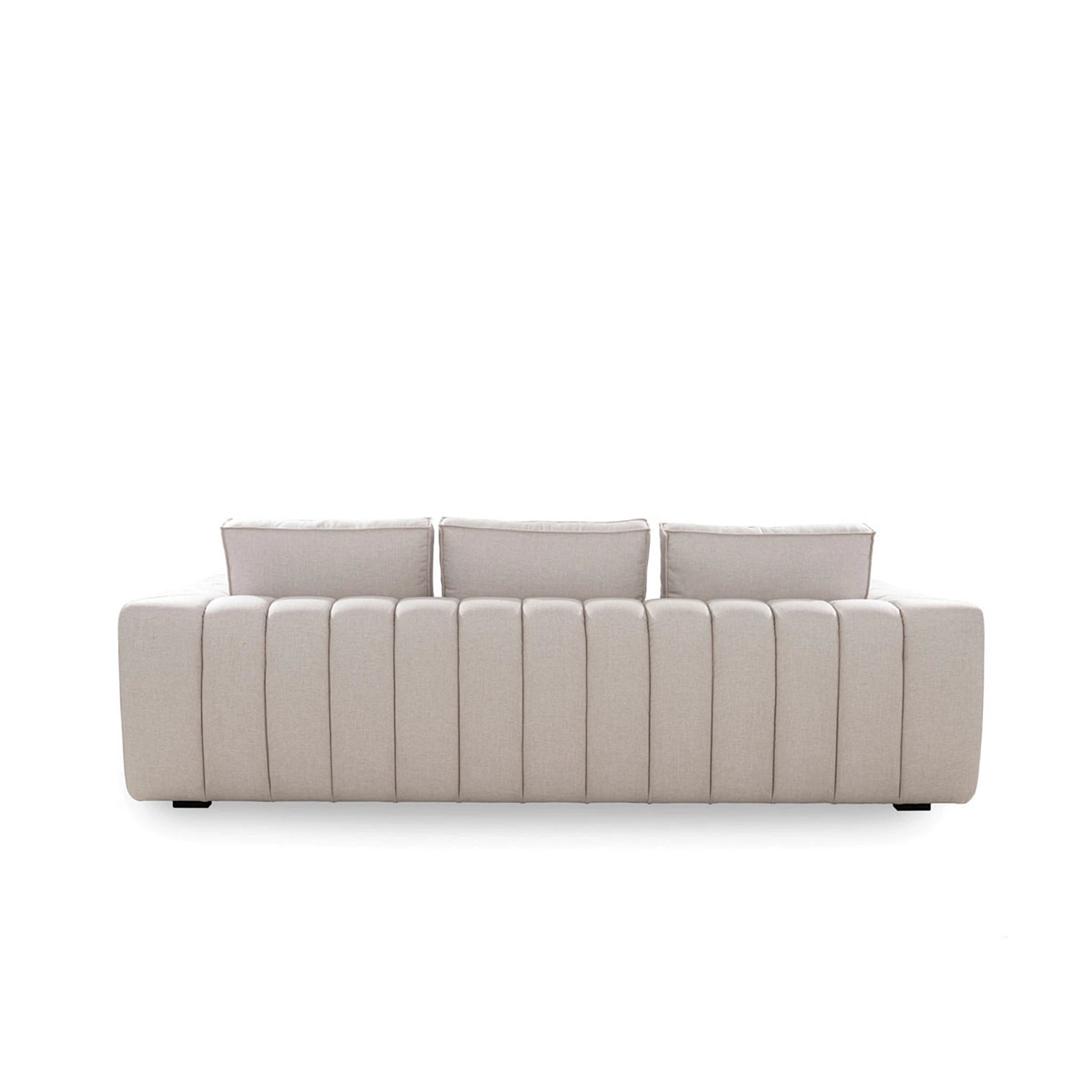 Beige sofa with three cushions on a white background