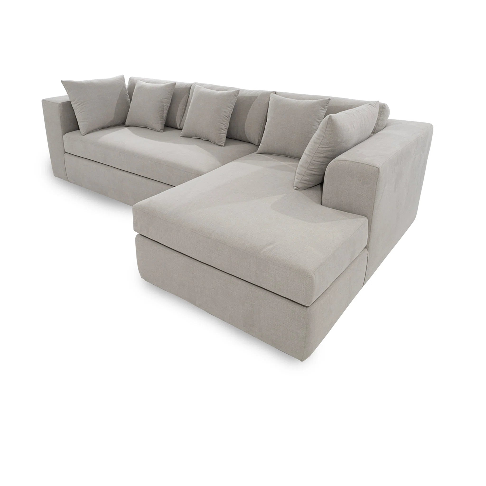 Gray sectional sofa with cushions on a white background