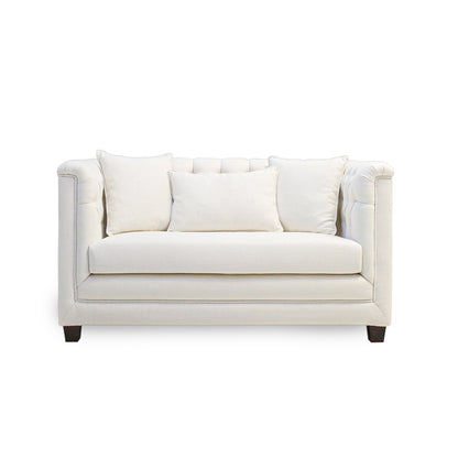 White sofa with three cushions on a white background