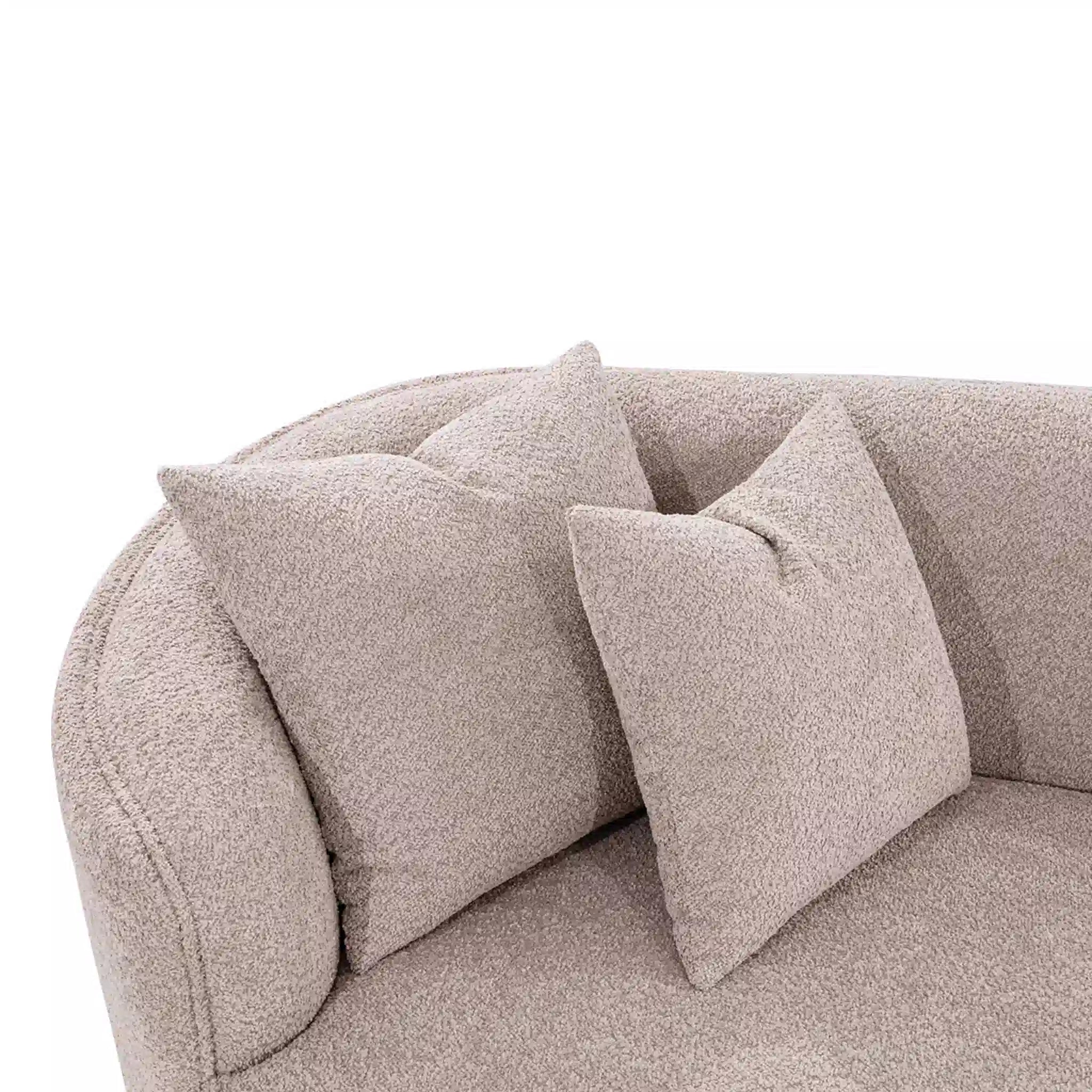 Beige sofa with decorative pillows on a white background
