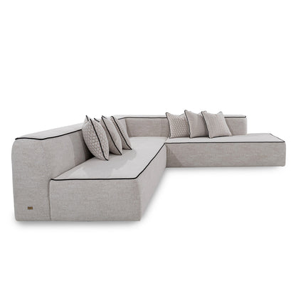 Gray sectional sofa with cushions on a white background