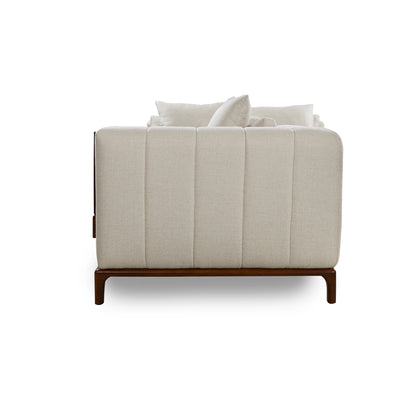 White upholstered chair with wooden legs on a white background