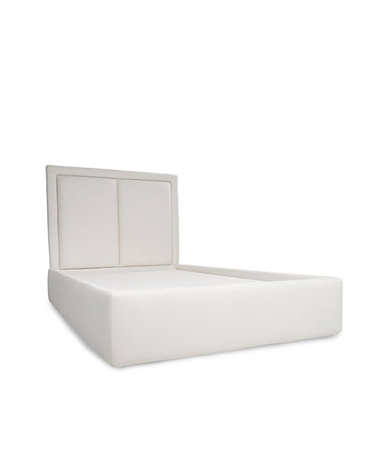 White upholstered bed with a headboard on a white background