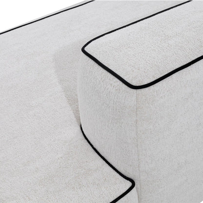 Close-up of a white bath mat with a black border on a white background