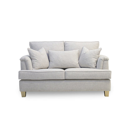 Gray sofa with three cushions on a white background