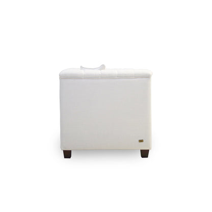 White ottoman with a small logo on a white background