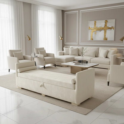 Modern living room with beige sofa, armchairs, and coffee table.