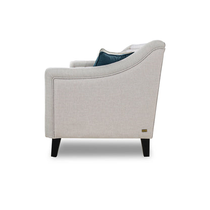Gray armchair with a blue cushion on a white background
