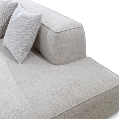 Gray fabric sofa with textured cushions on a white background
