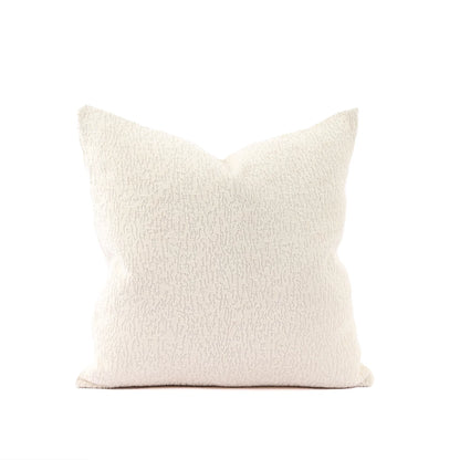 Beige textured pillow on a white background