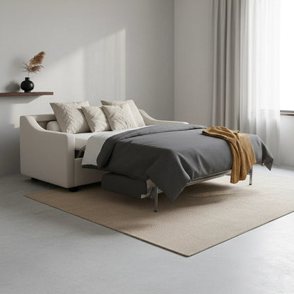 Modern bedroom with a bed and decorative pillows in a minimalistic setting.