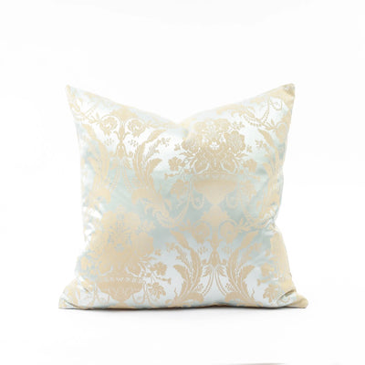 Decorative pillow with beige and white floral pattern on a white background