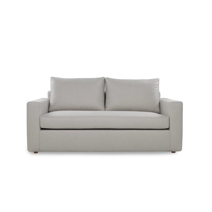 Gray sofa with two cushions on a white background