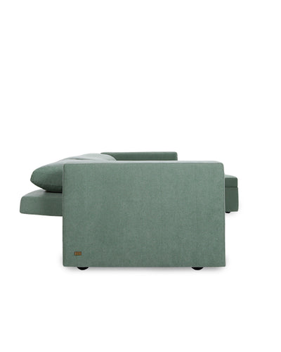 Green sectional sofa on a white background